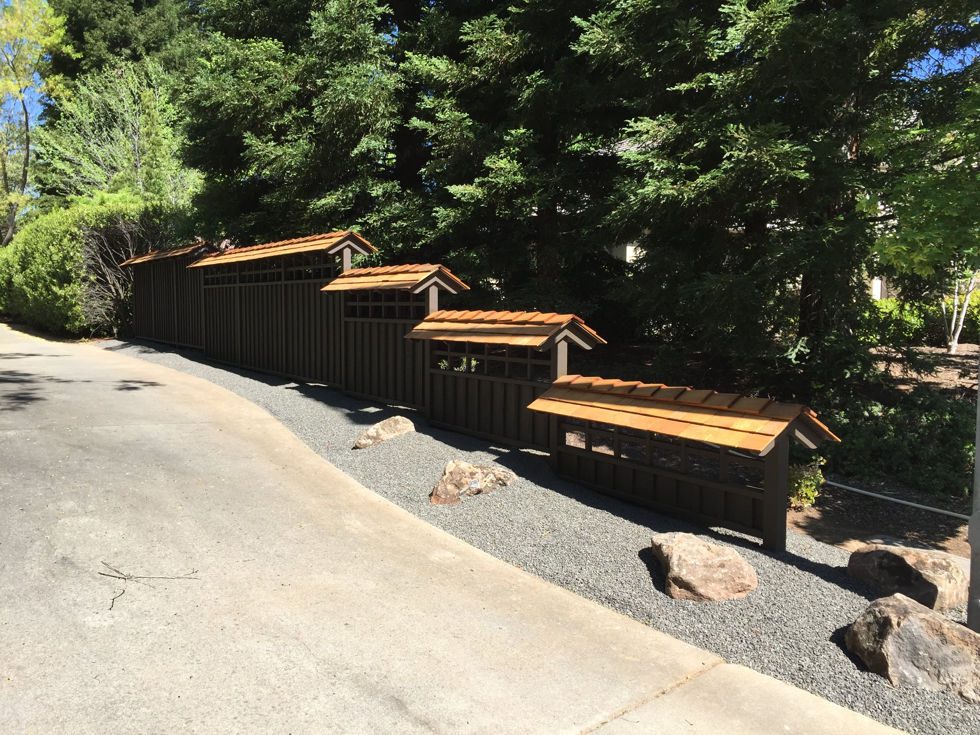 brown fence with roofing decals