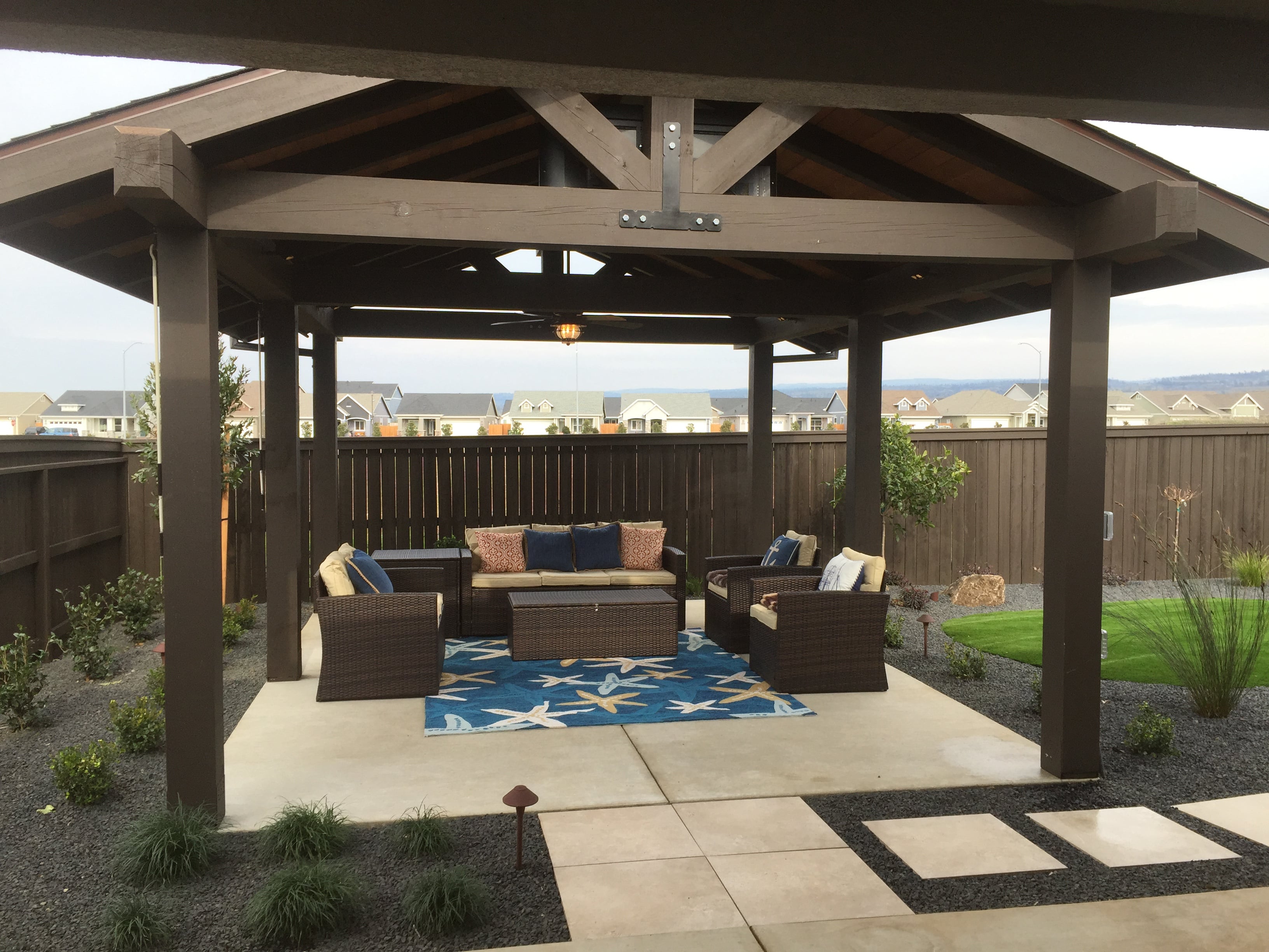 brown pergola over sitting area